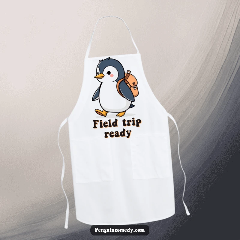 Funny apron with a penguin wearing a backpack and chef's hat, marching determinedly, perfect for humorous kitchen adventures.