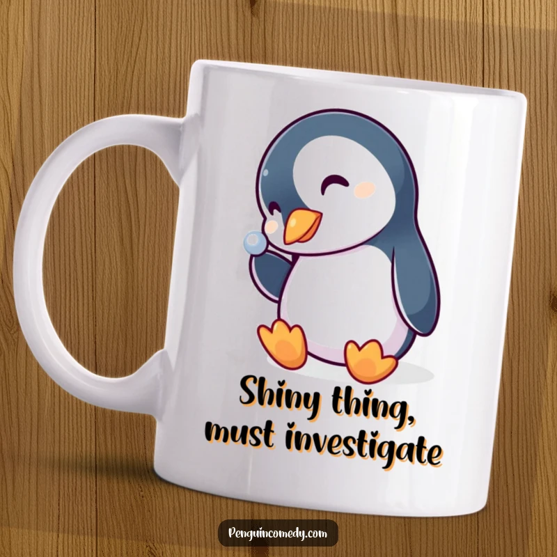Funny penguin mug with a curious expression, head tilted, staring intently at a sparkling, shiny object, capturing a moment of wonder.