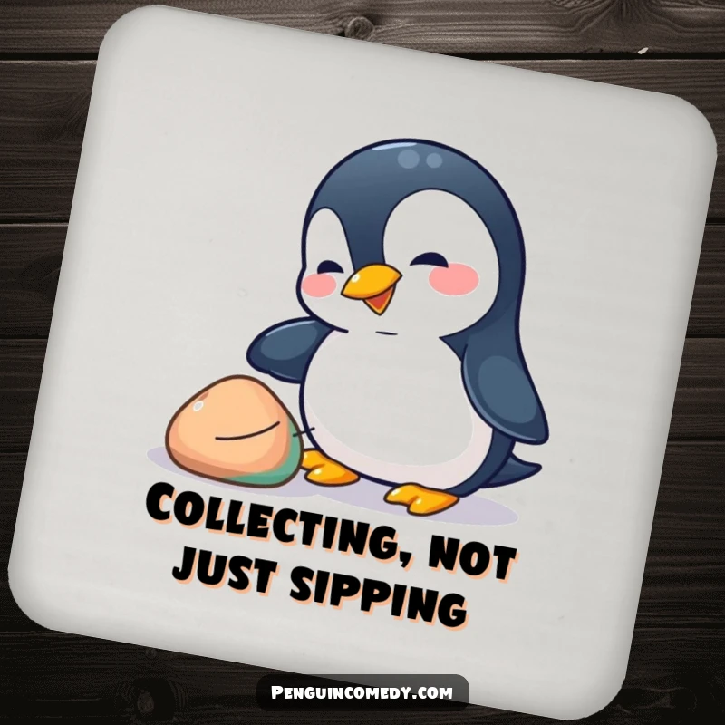 Funny penguin coaster depicting a playful penguin nudging a colorful pebble with its beak, adding hilarious charm to any surface.
