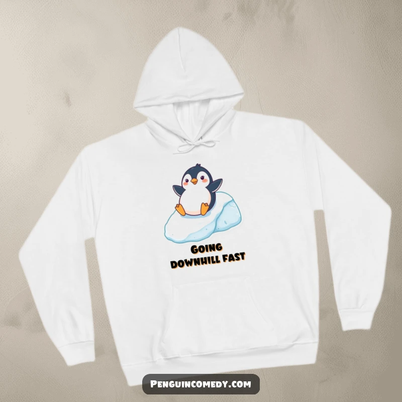 Funny Hoodie depicting a cheerful penguin sliding down an icy hill, cozy and full of winter fun, an ideal funny gift.