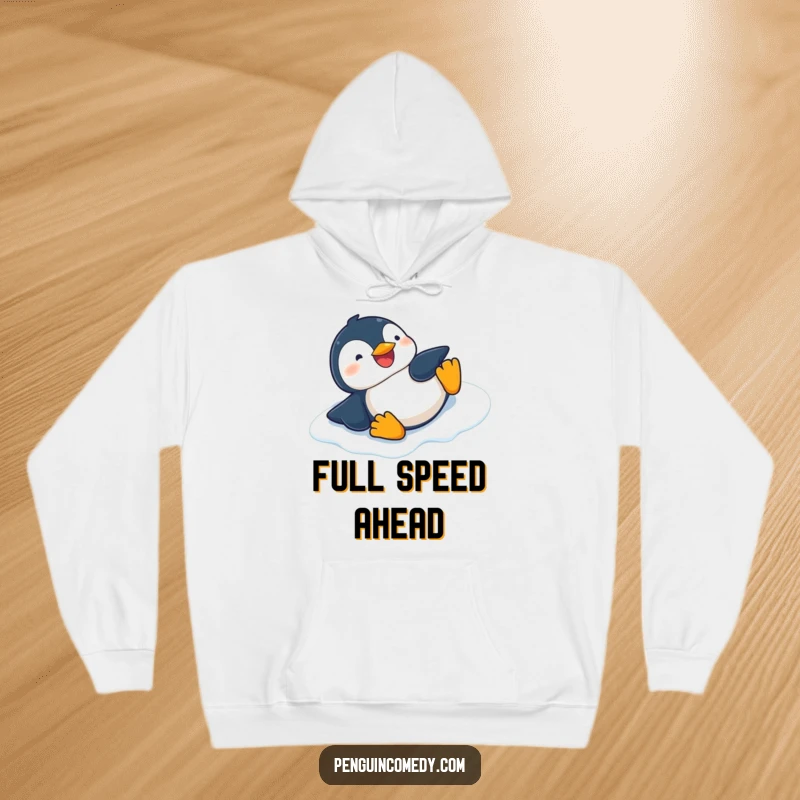 Funny comfortable hoodie featuring a giggling penguin sliding on its belly down an icy slope, perfect for cozying up.