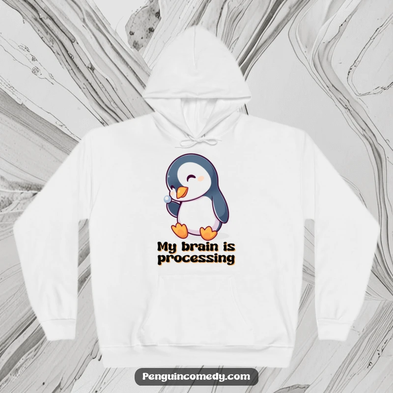 Funny penguin hoodie, a cute bird with head tilted, intently looking at a bright, shiny object, conveying playful curiosity.