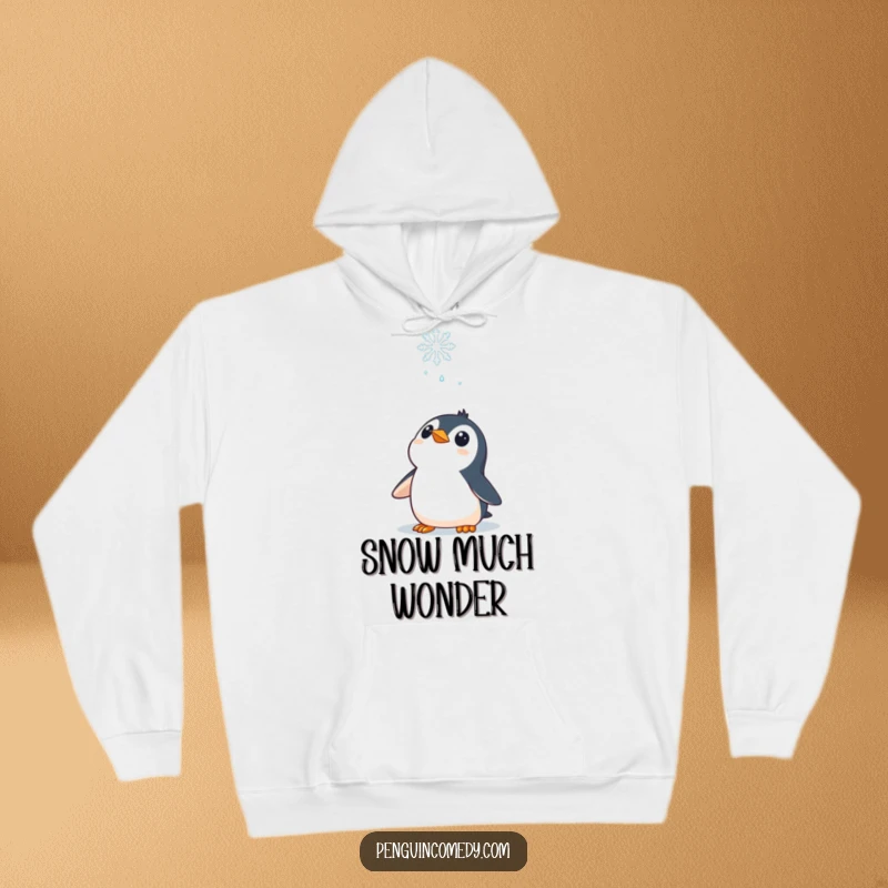 Funny Hoodie: A curious penguin character looking up at a falling snowflake, cozy and full of winter fascination.