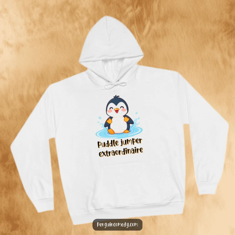Funny Penguin Splashing Puddle Hoodie, a warm hoodie featuring a playful penguin character enjoying a vigorous splash in a bright blue puddle.