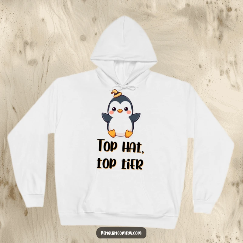 Funny hoodie featuring a penguin wearing a tiny hat, tipping it with a flourish, perfect for cozy elegance.