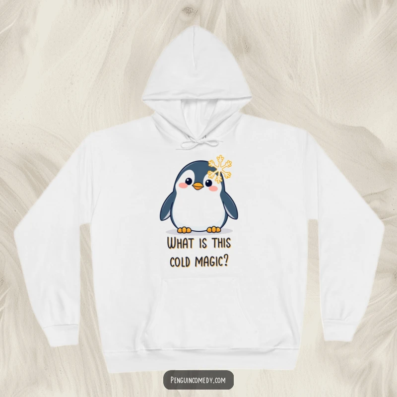 Funny hoodie designed with a penguin looking intently and curiously at a detailed snowflake, perfect for winter warmth.