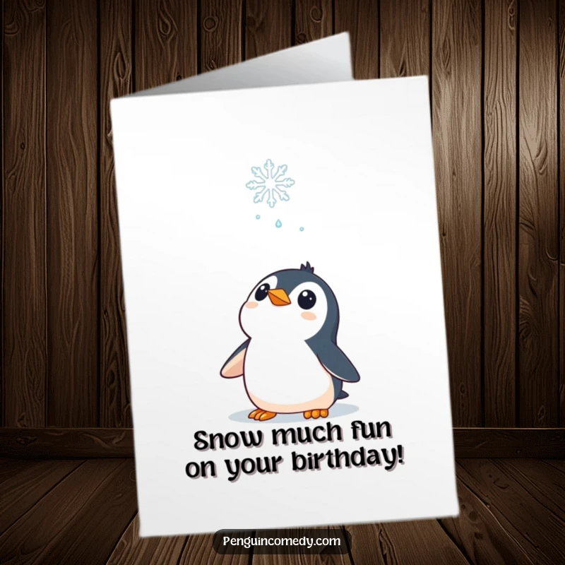 Funny Free Printable Birthday Card: A curious penguin gazes upward in awe at a single, perfect falling snowflake.