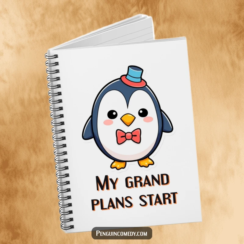 Funny penguin with a top hat and bowtie, featured on the cover of a notebook for stylish, humorous note-taking.