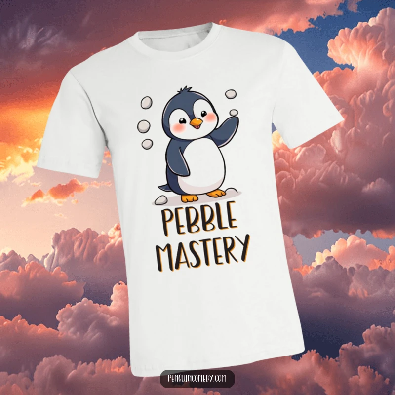 Funny penguin character depicted mid-juggle with three tiny pebbles, radiating chaotic charm on this comfortable t-shirt.