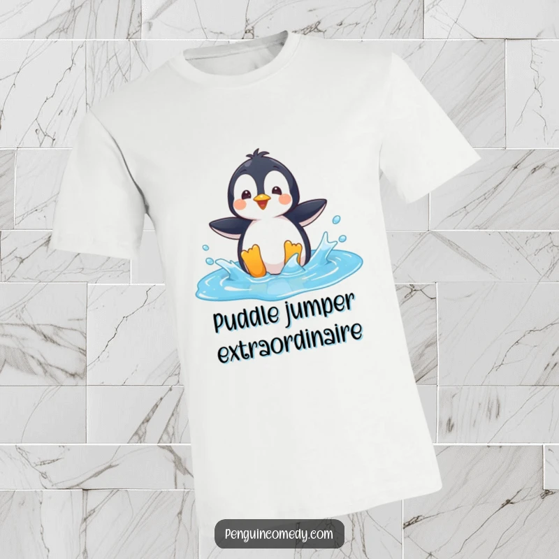 Funny T-Shirt: A playful penguin character joyfully splashing water in a bright blue puddle, full of energy.