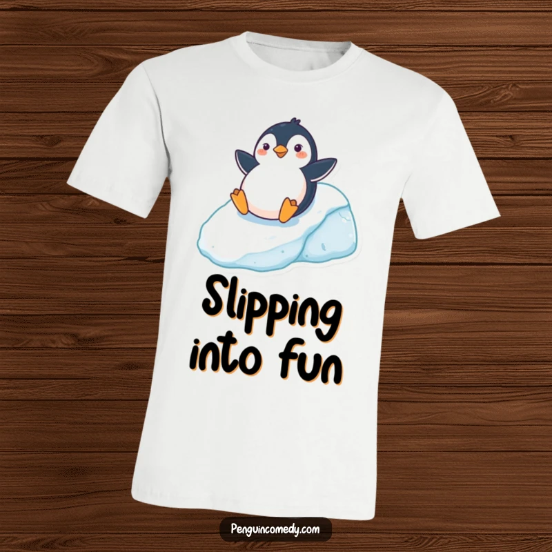 Funny T-Shirt featuring a cheerful penguin sliding on its belly down an icy hill, perfect for winter lovers, a unique funny gift.