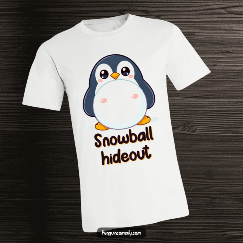 Funny penguin T-shirt depicting a shy penguin with wide eyes peeking from behind a snowball, cute and humorous.