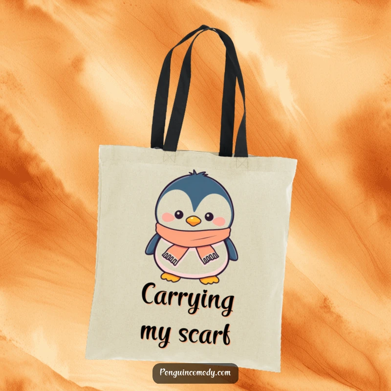 Funny penguin tote bag with a smiling penguin wearing a tiny scarf, symbolizing winter coziness and cheerful carrying.