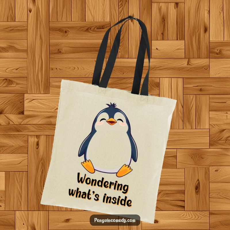Funny tote bag with a giggling penguin tilting its head, looking curiously upwards, perfect for everyday use.