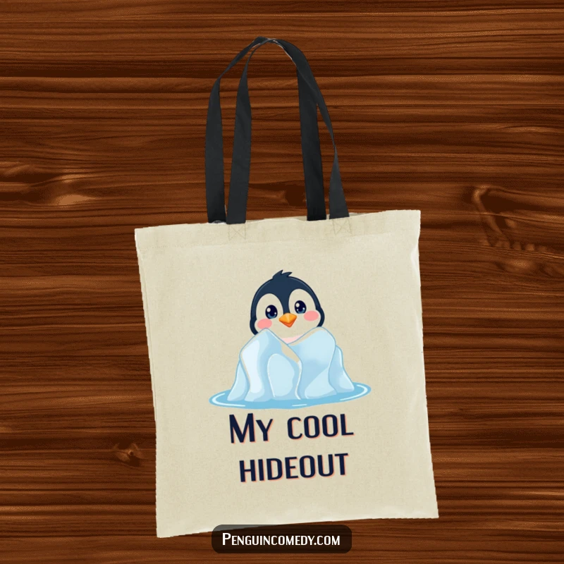 Funny tote bag showcasing a penguin with inquisitive eyes peeking from an iceberg, ideal for carrying treasures and secrets.