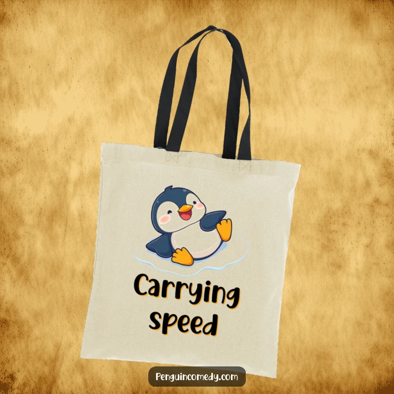 Funny reusable tote bag featuring a giggling penguin sliding on its belly down an icy slope, perfect for shopping.