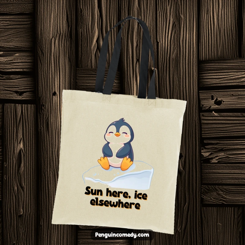 Funny penguin tote bag featuring a content penguin sunbathing on a snowy ledge, perfect for carrying groceries with a hilarious wintery charm.