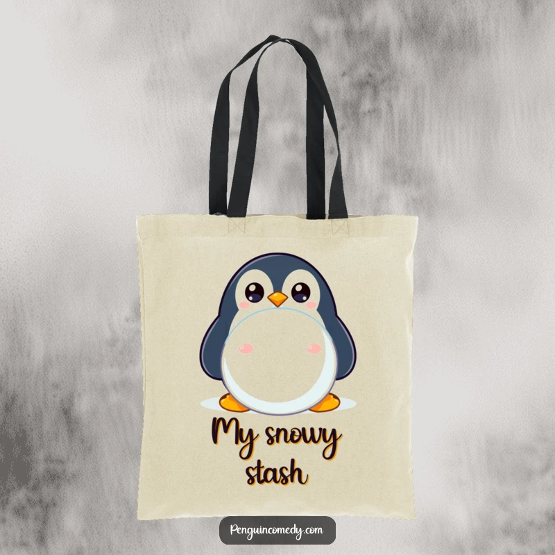 Funny tote bag featuring a shy penguin with wide eyes peeking from behind a snowball, a cute and humorous accessory.